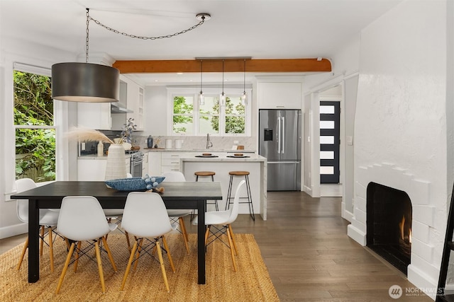 421 16th Ave E, Seattle, WA 98112 - dining area with dark wood-style flooring and baseboards