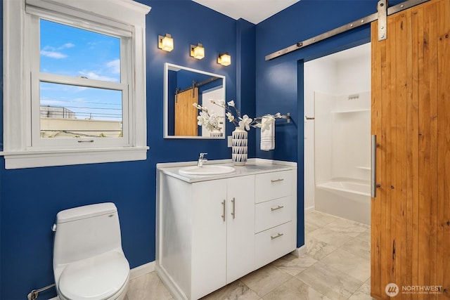 421 16th Ave E, Seattle, WA 98112 - bathroom with toilet, vanity, marble look tiles, baseboards, and shower / washtub combination