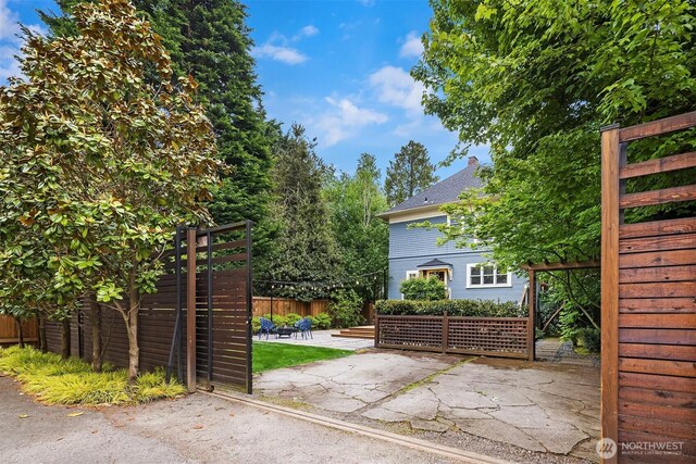 421 16th Ave E, Seattle, WA 98112 - gate featuring a patio area and fence
