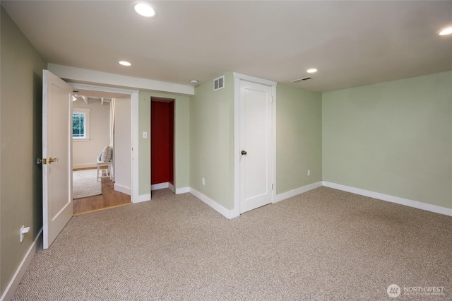 411 NW 56th St, Seattle, WA 98107 - unfurnished bedroom with light colored carpet, recessed lighting, baseboards, and a closet