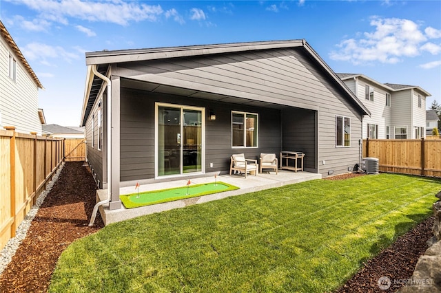 rear view of house with a putting area, a patio, central AC, and outdoor lounge area