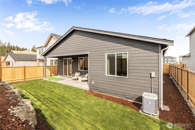 back of property featuring crawl space, central air condition unit, and a patio