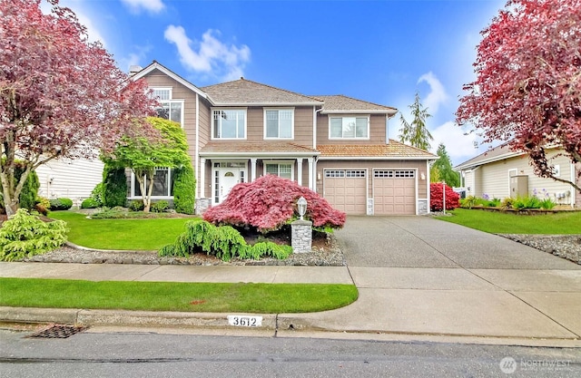 3612 Spyglass Dr NE, Tacoma, WA 98422 - traditional home with concrete driveway, a front lawn, and a garage