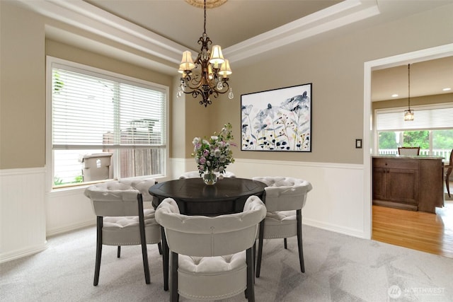 3612 Spyglass Dr NE, Tacoma, WA 98422 - carpeted dining room with a chandelier, a wainscoted wall, plenty of natural light, and a tray ceiling