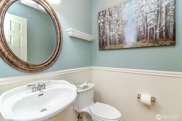 3612 Spyglass Dr NE, Tacoma, WA 98422 - half bathroom featuring a sink, a wainscoted wall, and toilet