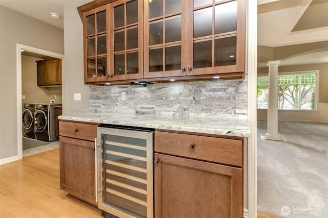 3612 Spyglass Dr NE, Tacoma, WA 98422 - indoor dry bar with beverage cooler, washing machine and dryer, ornate columns, and tasteful backsplash