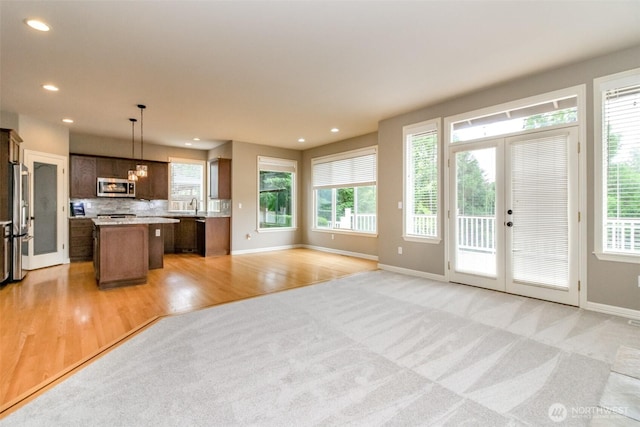 3612 Spyglass Dr NE, Tacoma, WA 98422 - kitchen featuring stainless steel appliances, a center island, healthy amount of natural light, open floor plan, and recessed lighting