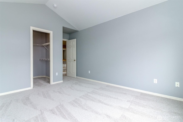 3612 Spyglass Dr NE, Tacoma, WA 98422 - unfurnished bedroom featuring carpet, lofted ceiling, a spacious closet, baseboards, and a closet