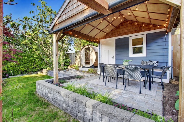 7508 13th Ave SW, Seattle, WA 98106 - view of patio / terrace featuring a shed and outdoor dining area