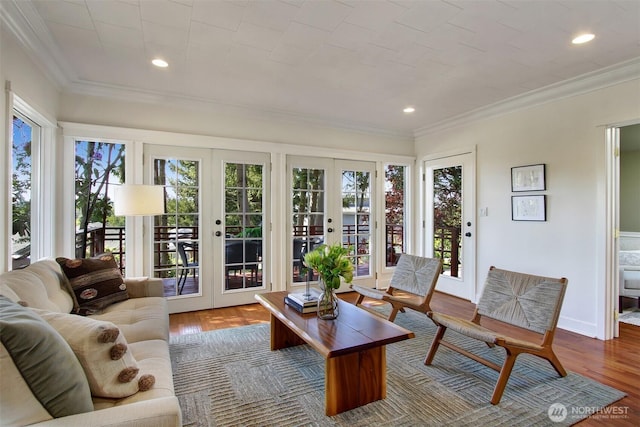 7508 13th Ave SW, Seattle, WA 98106 - living area with french doors, healthy amount of natural light, ornamental molding, wood finished floors, and recessed lighting