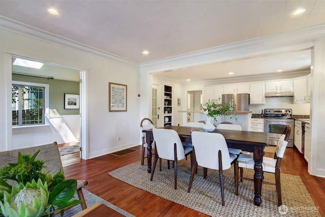 7508 13th Ave SW, Seattle, WA 98106 - dining room with crown molding, dark wood finished floors, recessed lighting, and baseboards