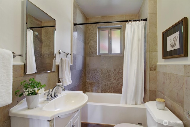 7508 13th Ave SW, Seattle, WA 98106 - full bathroom featuring tile walls, toilet, vanity, and shower / bath combo with shower curtain