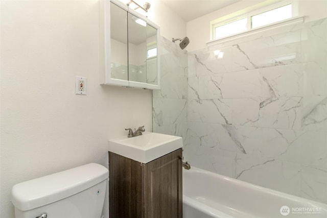 full bathroom with washtub / shower combination, toilet, and vanity
