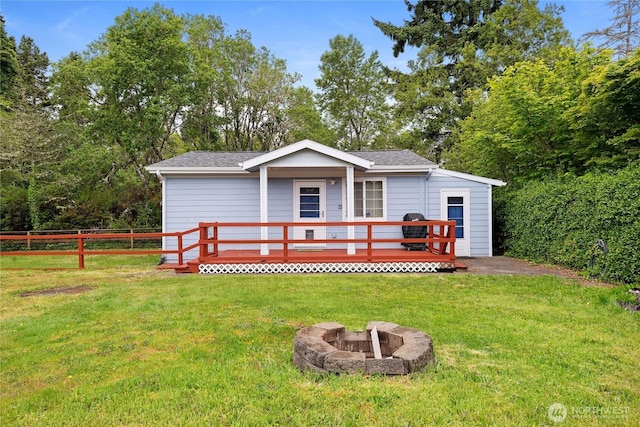 2019 Joe Johns Rd, Ocean Park, WA 98640 - view of front of house featuring a fire pit, a deck, and roof with shingles