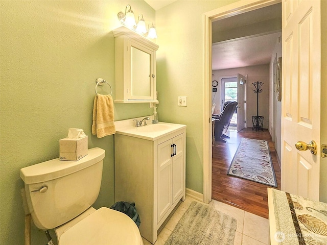 2019 Joe Johns Rd, Ocean Park, WA 98640 - bathroom with toilet, tile patterned floors, vanity, and baseboards