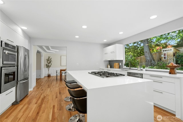 4877 167th Ave SE, Bellevue, WA 98006 - kitchen with appliances with stainless steel finishes, modern cabinets, white cabinetry, light countertops, and recessed lighting