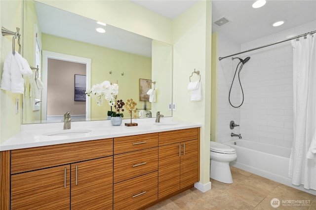 4877 167th Ave SE, Bellevue, WA 98006 - full bath with double vanity, toilet, shower / bath combo with shower curtain, tile patterned floors, and recessed lighting