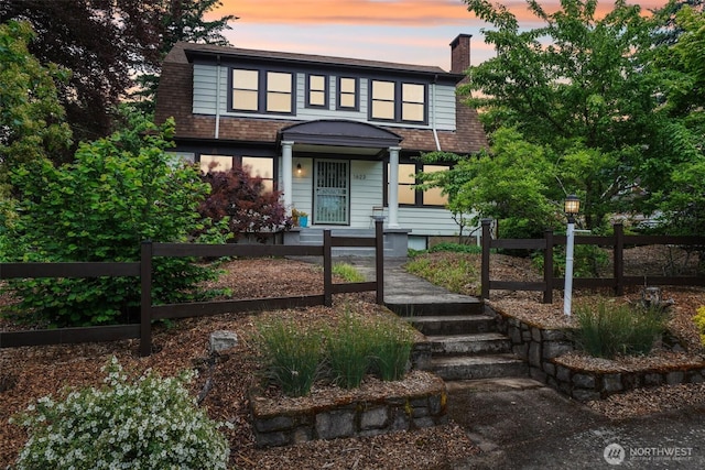 1623 Division St, Camas, WA 98607 - view of front of home with a fenced front yard and a chimney