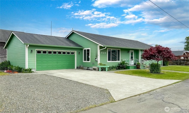 510 Oregon Ave N, Long Beach, WA 98631 - ranch-style house featuring driveway, an attached garage, a front lawn, and a shingled roof