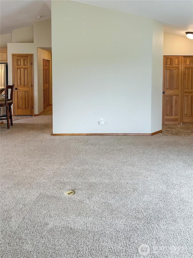 510 Oregon Ave N, Long Beach, WA 98631 - spare room featuring carpet floors, baseboards, and lofted ceiling