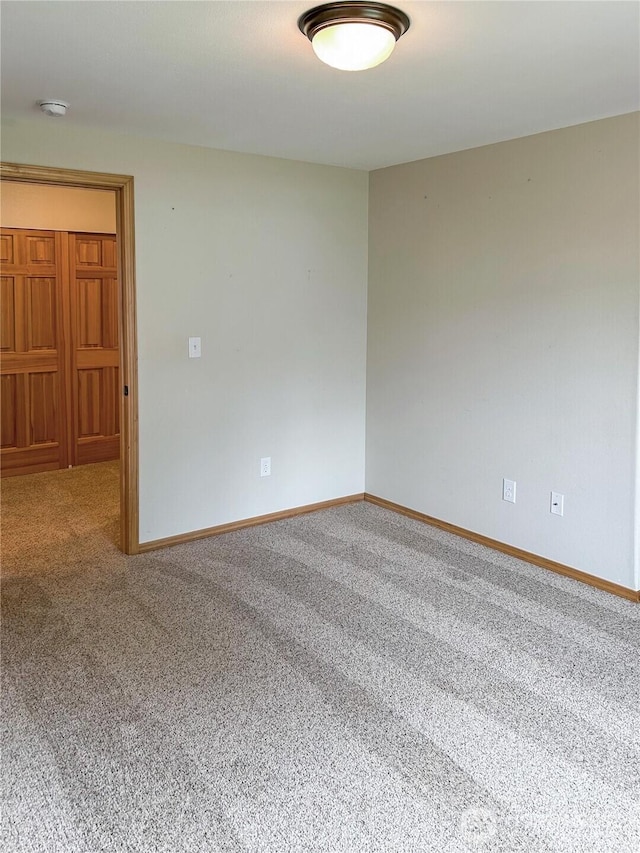 510 Oregon Ave N, Long Beach, WA 98631 - spare room featuring carpet, baseboards, and a smoke detector
