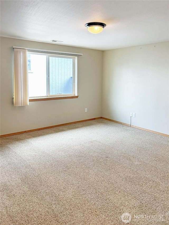 510 Oregon Ave N, Long Beach, WA 98631 - carpeted spare room featuring baseboards