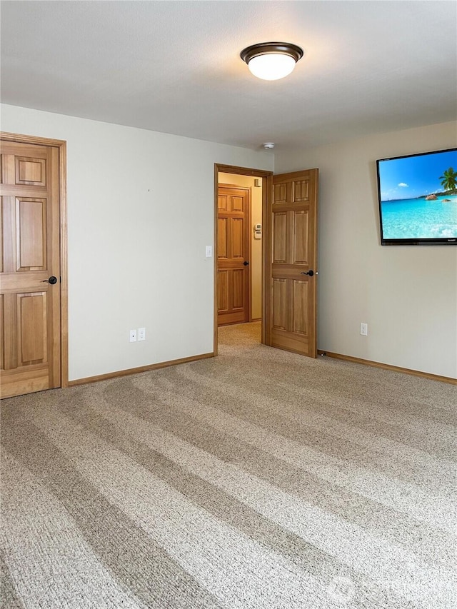 510 Oregon Ave N, Long Beach, WA 98631 - unfurnished room featuring carpet floors and baseboards
