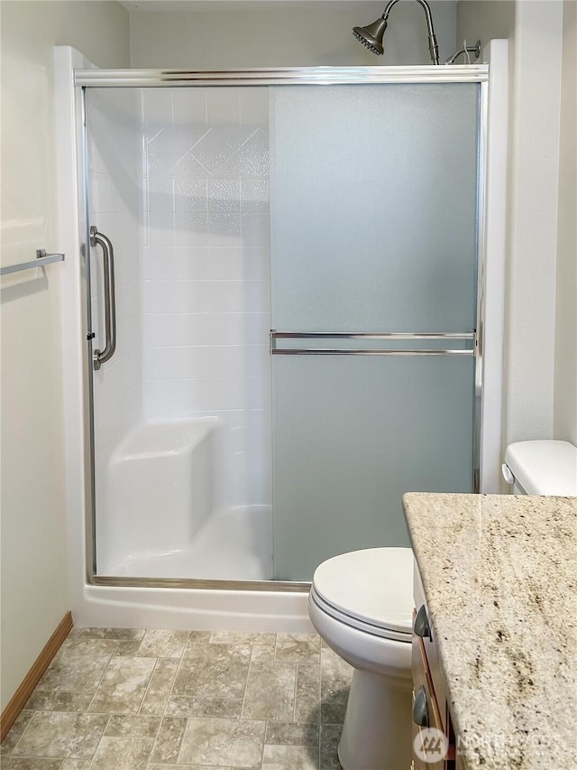 510 Oregon Ave N, Long Beach, WA 98631 - full bathroom featuring toilet, vanity, and a stall shower
