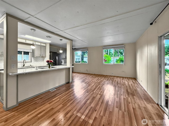 18425 NE 95th St Unit 8, Redmond, WA 98052 - unfurnished living room with wood finished floors
