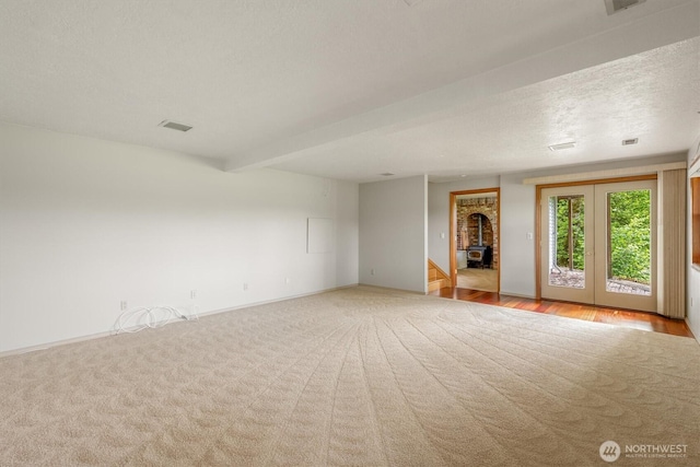 187 Acorn, Longview, WA 98632 - carpeted empty room with baseboards and a textured ceiling