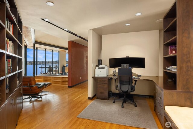 7703 W Mercer Way, Mercer Island, WA 98040 - office space with light wood-type flooring, recessed lighting, and a wall of windows