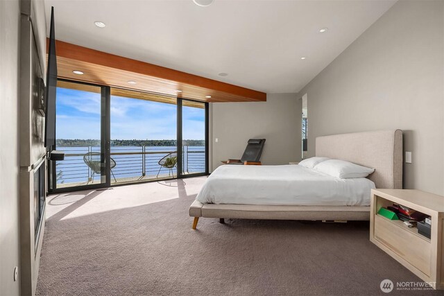 7703 W Mercer Way, Mercer Island, WA 98040 - bedroom featuring dark carpet, access to exterior, expansive windows, a water view, and recessed lighting