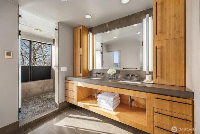 7703 W Mercer Way, Mercer Island, WA 98040 - bathroom with tile patterned flooring, recessed lighting, double vanity, and tiled shower