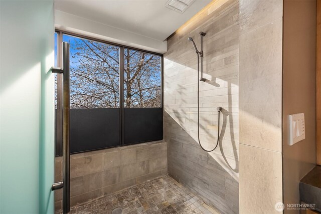 7703 W Mercer Way, Mercer Island, WA 98040 - full bathroom featuring tiled shower