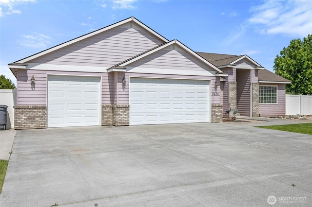 9488 SE Benjamin Way, Moses Lake, WA 98837 - ranch-style house with brick siding, driveway, a garage, and fence