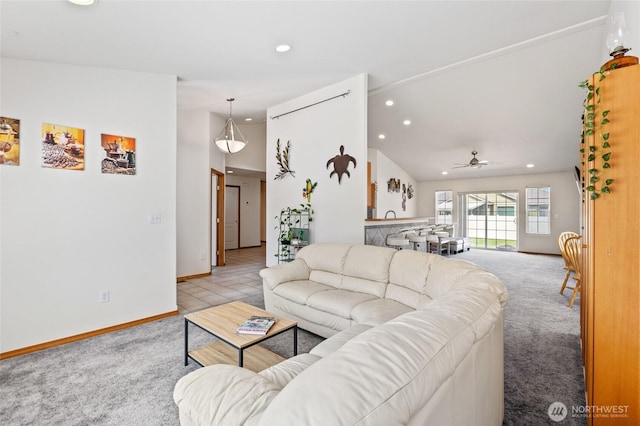 9488 SE Benjamin Way, Moses Lake, WA 98837 - living area featuring light carpet, lofted ceiling, recessed lighting, ceiling fan, and baseboards