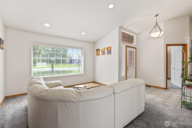 9488 SE Benjamin Way, Moses Lake, WA 98837 - living room with baseboards, recessed lighting, vaulted ceiling, and light colored carpet