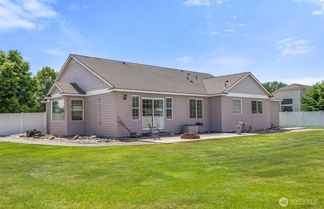 9488 SE Benjamin Way, Moses Lake, WA 98837 - rear view of house with a patio, an outdoor fire pit, and a shingled roof