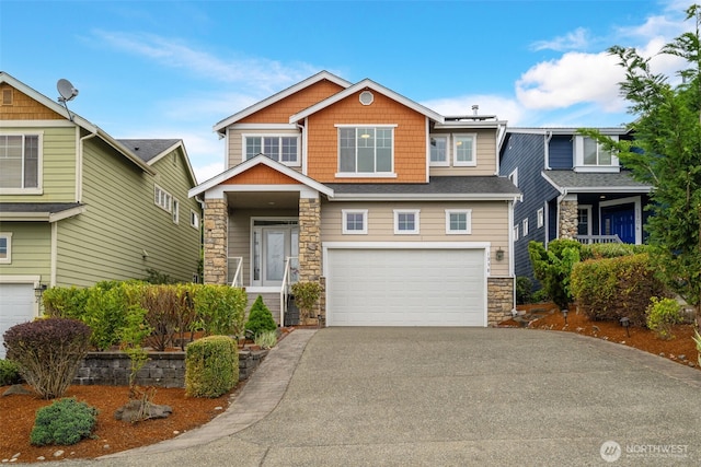 1338 Beacon Way S, Renton, WA 98057 - craftsman-style house with stone siding, driveway, and an attached garage