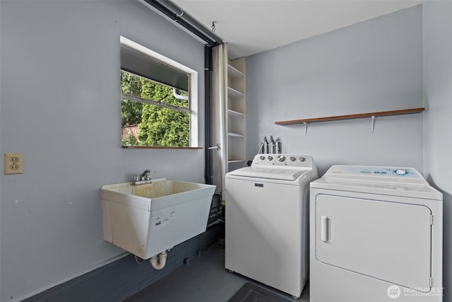 washroom with washing machine and dryer