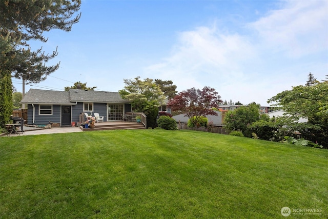 view of yard featuring a wooden deck