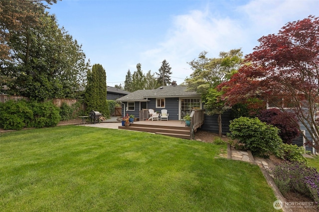back of house with a wooden deck