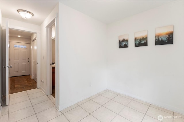 corridor with light tile patterned floors