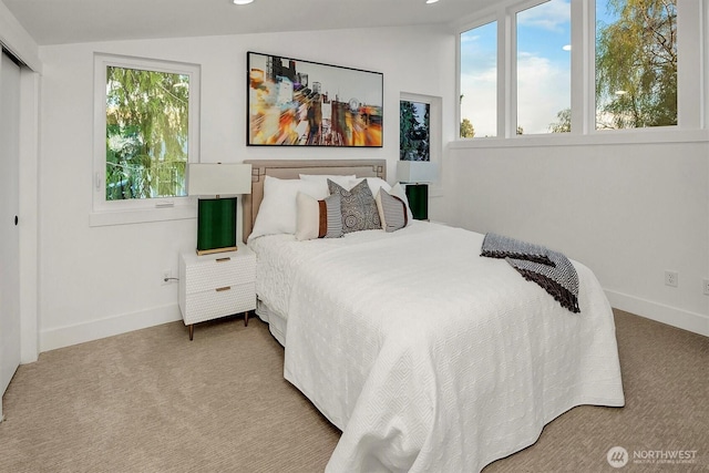7350 21st Ave NW, Seattle, WA 98117 - bedroom featuring vaulted ceiling, carpet floors, recessed lighting, and a closet