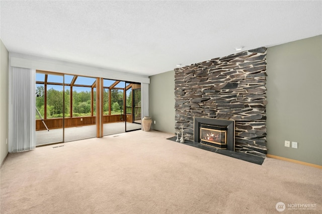 10410 260th St E, Graham, WA 98338 - unfurnished living room featuring carpet flooring and a stone fireplace