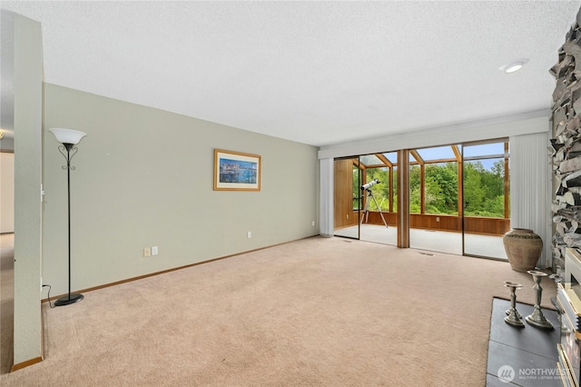 10410 260th St E, Graham, WA 98338 - unfurnished living room featuring carpet floors and baseboards