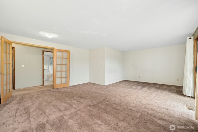 10410 260th St E, Graham, WA 98338 - spare room featuring french doors and carpet flooring