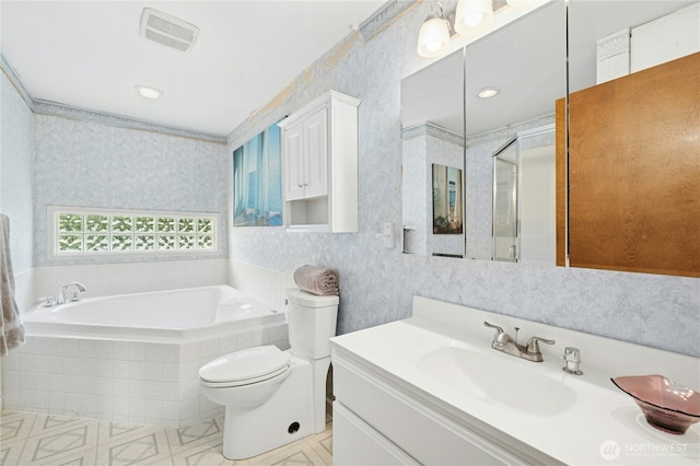 10410 260th St E, Graham, WA 98338 - full bathroom with wallpapered walls, a bath, a shower stall, vanity, and toilet