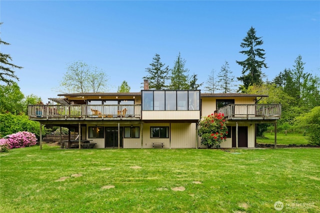 10410 260th St E, Graham, WA 98338 - rear view of property with a deck, a yard, and a chimney