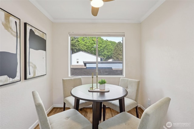 260 Newport Way NW Unit C24, Issaquah, WA 98027 - dining area featuring wood finished floors, baseboards, a ceiling fan, and ornamental molding